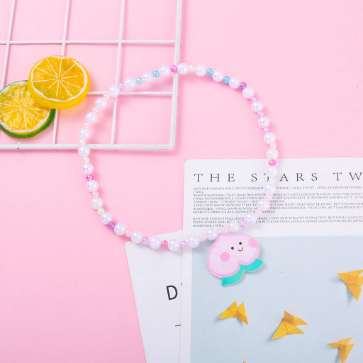 Collar infantil con cuentas de sirena de melocotón y miel