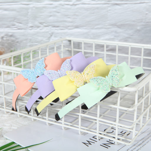 Diadema con moño y purpurina