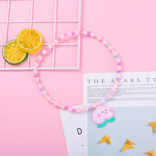 Collar infantil con cuentas de sirena de melocotón y miel
