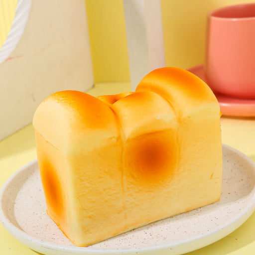 Juguete de rebote lento de pan y mantequilla.