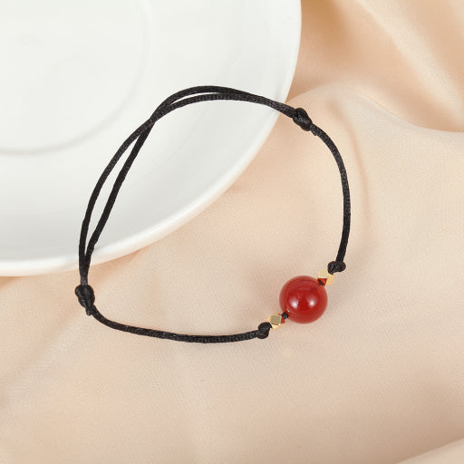 Pulsera de hilo rojo y negro de ónix