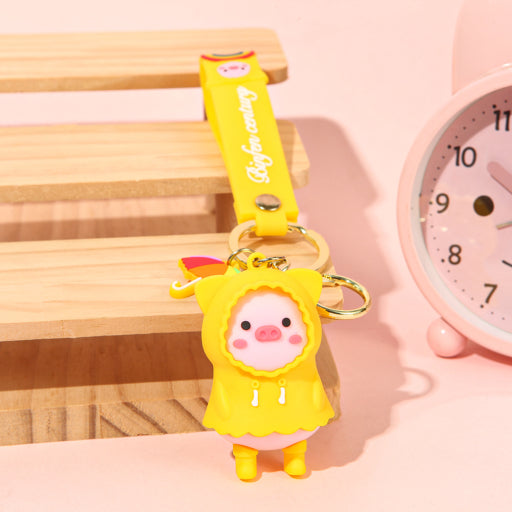 Llavero cerdito con impermeable