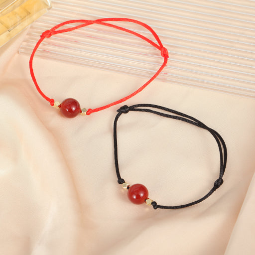Pulsera de hilo rojo y negro de ónix