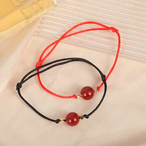 Pulsera de hilo rojo y negro de ónix