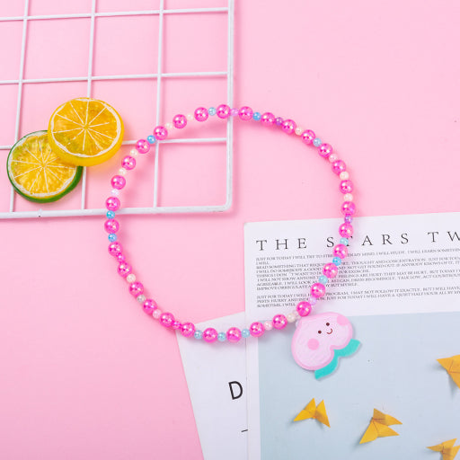Collar infantil con cuentas de sirena de melocotón y miel