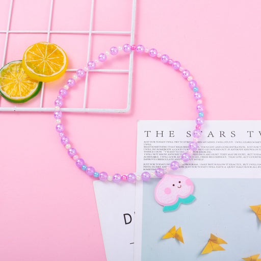 Collar infantil con cuentas de sirena de melocotón y miel