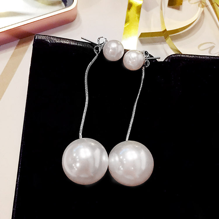 Hermosos aretes largos con perla