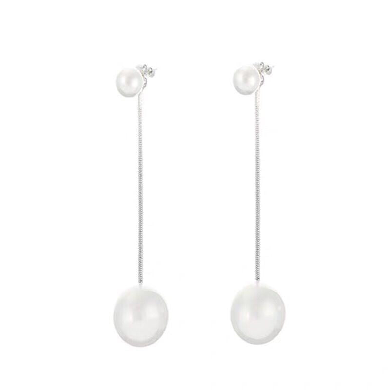 Hermosos aretes largos con perla