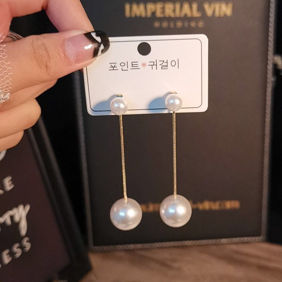 Hermosos aretes largos con perla