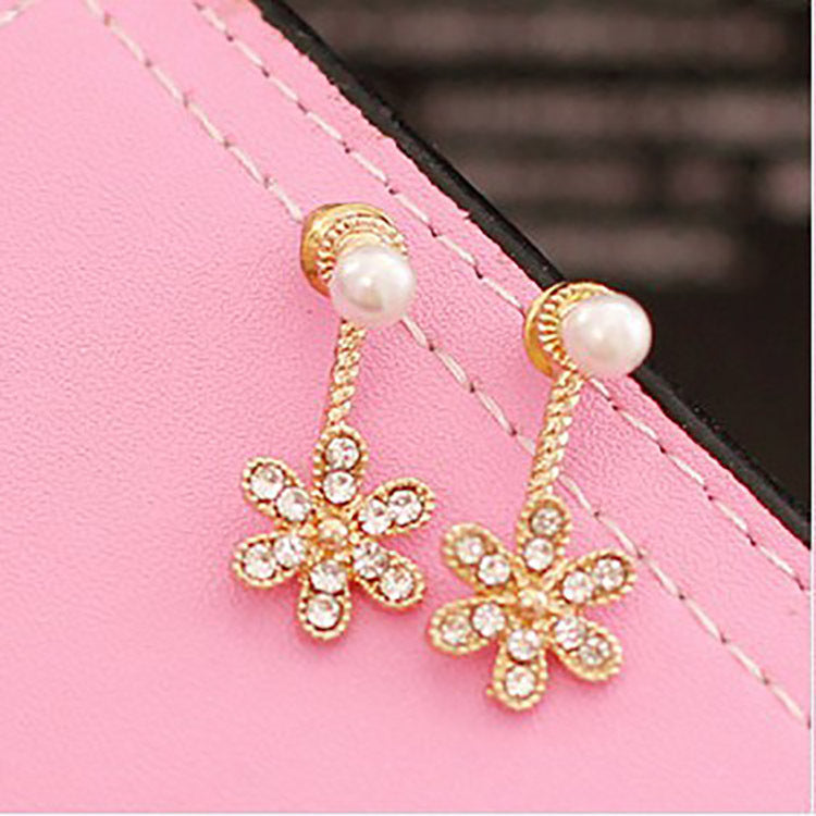 Aretes con diseño de flor