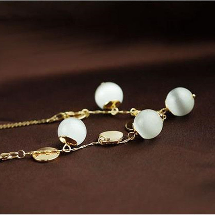 Elegante collar de bolitas