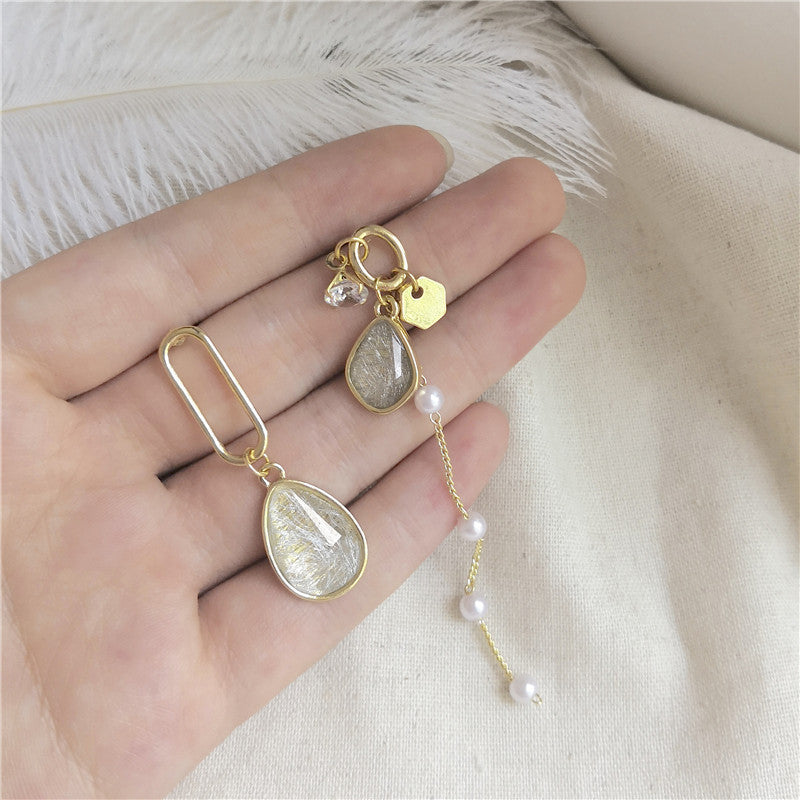 Juego de aretes con diseño de piedra