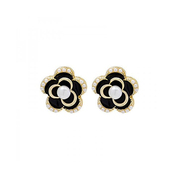 Juego de aretes con forma de flor negro y perla incrustada