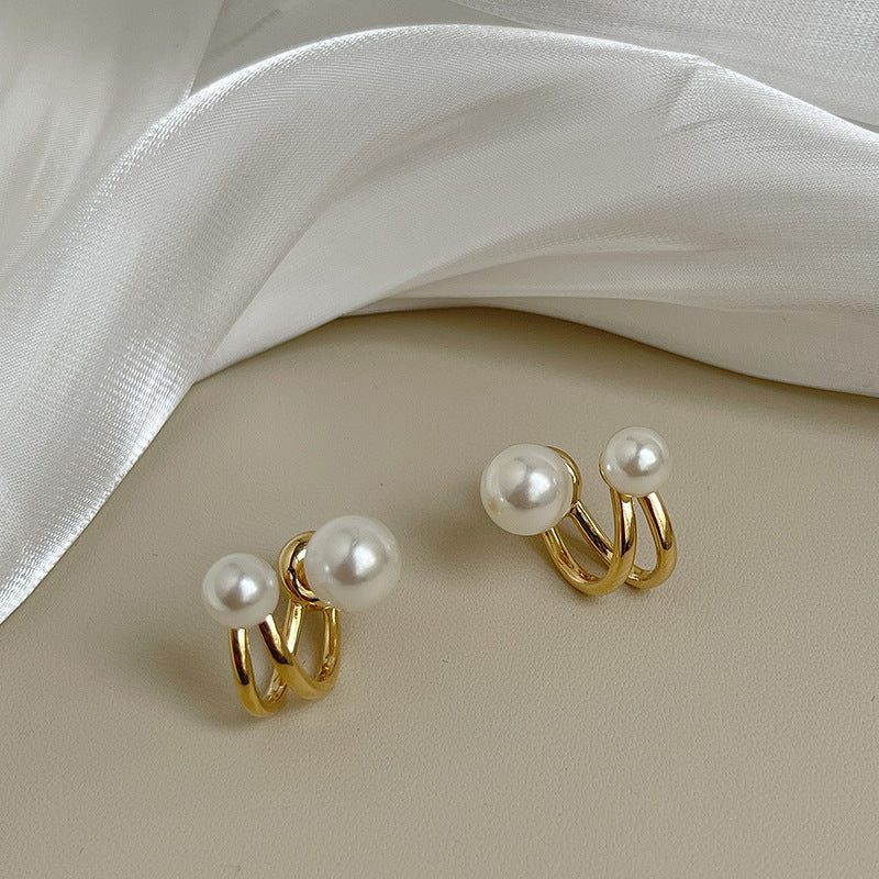 Juego de aretes con doble perla