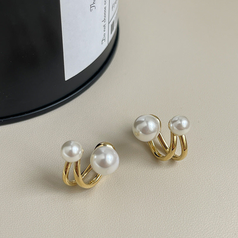 Juego de aretes con doble perla