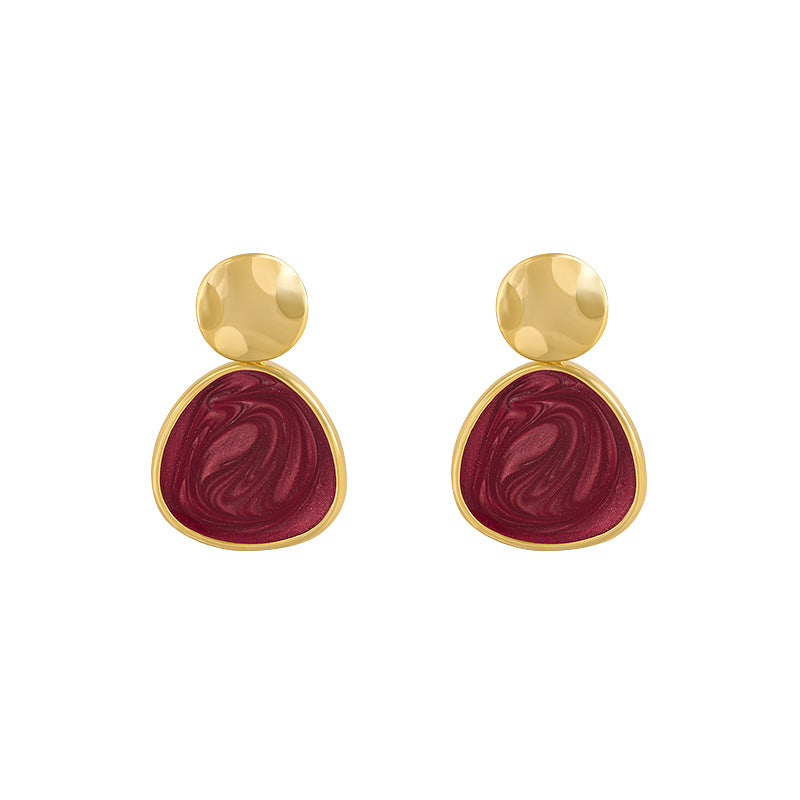 Juego de pendientes abiertos con corazon irregular color rojo