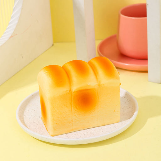 Juguete de rebote lento de pan y mantequilla.