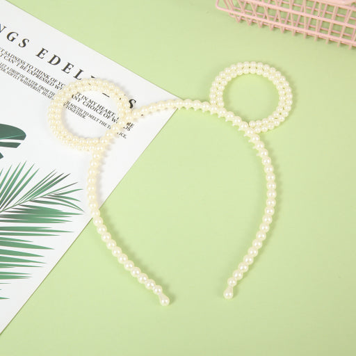 Diadema de perlas con orejas de oso