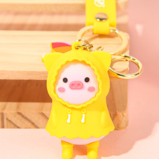 Llavero cerdito con impermeable
