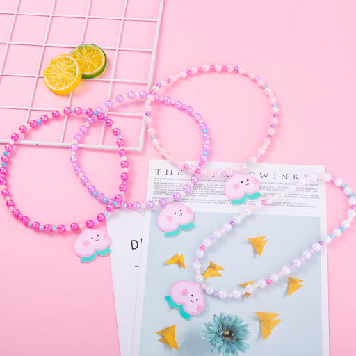 Collar infantil con cuentas de sirena de melocotón y miel