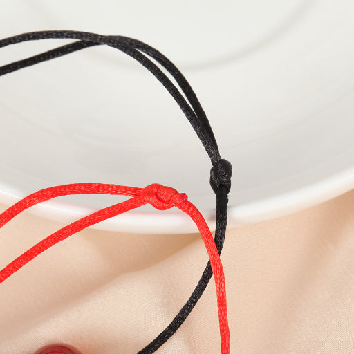 Pulsera de hilo rojo y negro de ónix