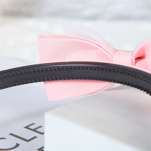 Diadema con moño de color liso de malla