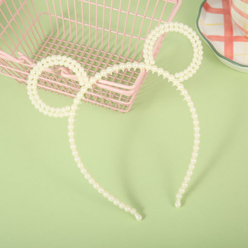 Diadema de perlas con orejas de oso