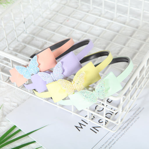 Diadema con moño y purpurina