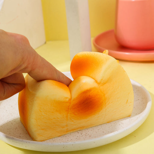 Juguete de rebote lento de pan y mantequilla.